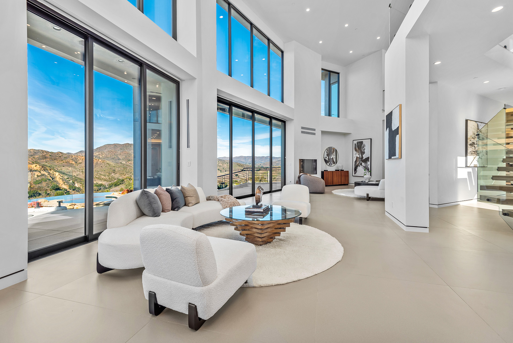 Stunning luxury home exterior at dusk with warm interior lighting